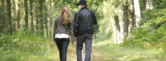 Older couple walking together in nature